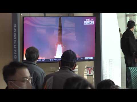 Seoul residents watch news on latest North Korea missile launch