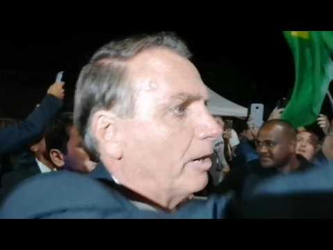 Brazil's Bolsonaro greets supporters after presidential debate