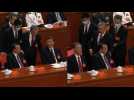 Former Chinese leader Hu unexpectedly leaves Congress closing ceremony