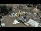 Neighbours, rescuers search for 52 missing after Venezuela landslide