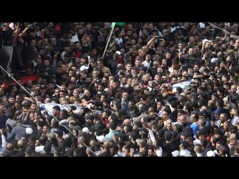 Thousands of people carry bodies of killed Palestinians in downtown Nablus