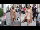 Watch video of As Kim Kardashian Sports Her Favorite Beige Coat In Los Angeles, We're Checking Out The Celebrity Cover-ups Of The Season. - Celebrities Get Ready For Fall in Beige Coats - Label : Splash Fashion -