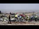 Workers clean debris at Ethiopia plane crash site