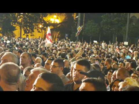 Thousands of protesters try to storm Georgia parliament