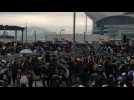 Anti-government protesters block main arteries in Hong Kong