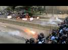 Police charge and fire tear gas at protesters in Hong Kong