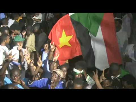 Sudanese take part in second day of general strike in Khartoum at night