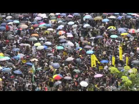 Hong Kong protesters arrive at Victoria Park for planned huge rally