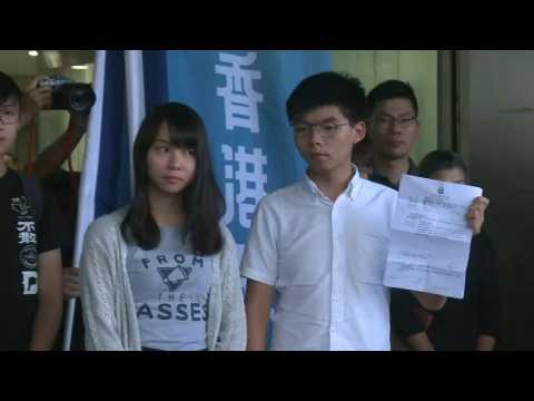 Hong Kong activist Joshua Wong leaves court after arrest