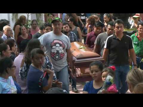 Families start to bury victims of Mexico bar fire attack