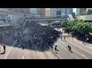 Protesters block road near key HK government offices