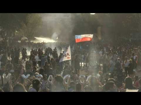 Police fire tear gas, water cannons at protesters in Santiago