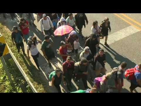 Hundreds of Central American migrants cross into Mexico from Guatemala