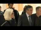 Former French PM arrives in court with wife Penelope at start of fraud trial