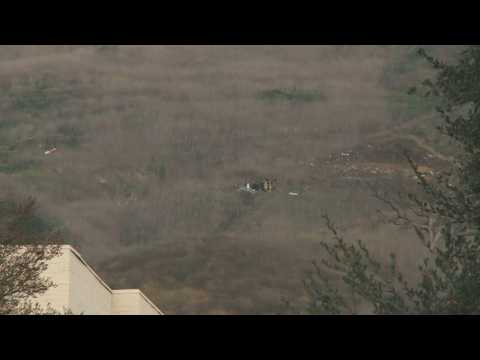 Authorities prepare body bags at Kobe Bryant helicopter crash site