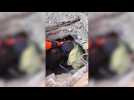Turkish aid workers pull woman from collapsed building