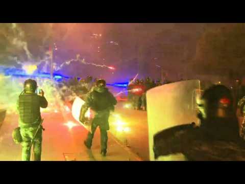 Lebanon's protesters use fireworks during clashes outside parliament