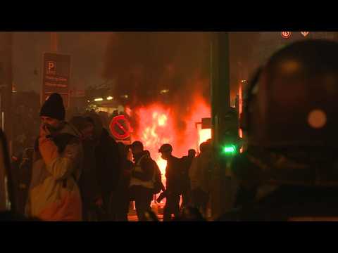 Fires, tear gas and arrests after yellow vest protest in Paris