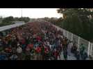 Thousands of migrants await to enter Mexico legally on border bridge