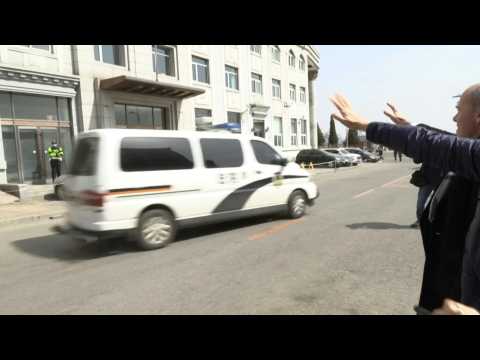 Police vehicles leave Chinese court as Canadian's trial wraps up