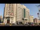 Images outside court building where trial set to begin of Canadian detained in China