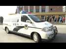 Police vehicles arrive at Chinese court as trial of detained Canadian set to begin