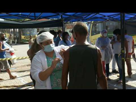 People over 65 receive Covid vaccine in Rio as cases surge in Brazil