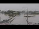 Bridge submerged as Australian flooding disaster worsens