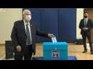 Israeli President Reuven Rivlin casts his vote in the Israeli elections