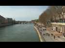 Parisians enjoy spring weather on the banks of the Seine river
