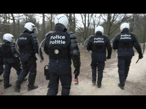 Riot police deployed for a second evening in Brussels park