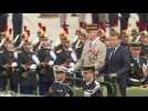 Macron arrives at downsized Bastille Day