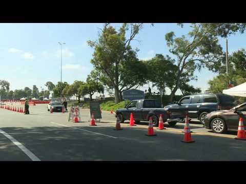 Cars line up at COVID-19 testing site in Los Angeles as cases surge