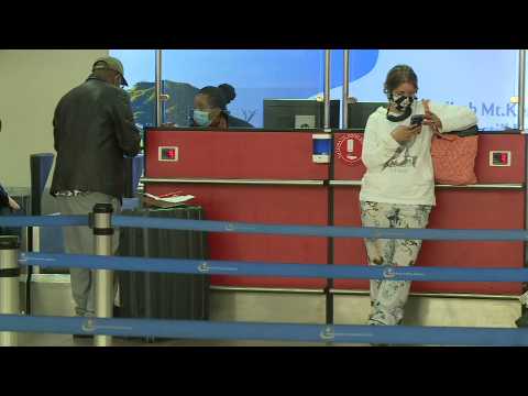 Passengers at airport after Kenya reopens for international flights