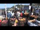 Migrants rush to get food and water after Lesbos camp fire