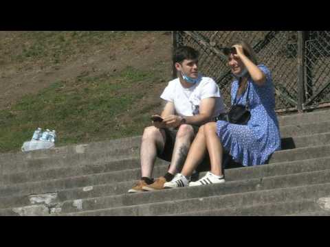 In Paris, tourists and Parisians enjoy the hot day