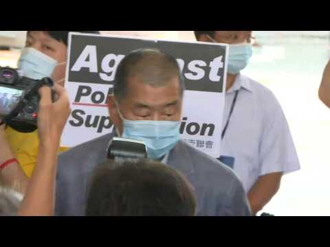 Hong Kong activists arrive for court hearing over Tiananmen vigil