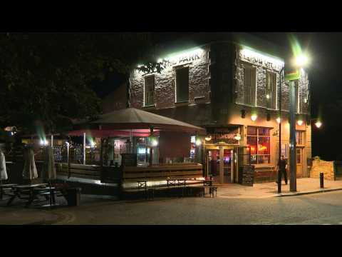 London's pubs close as first night of virus curfew begins