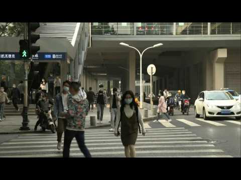 Rush hour in Wuhan as global coronavirus death toll nears one million