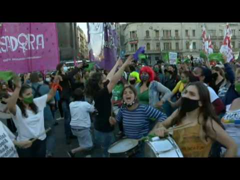 Argentine women hold up green scarves in demand for legal abortion