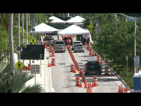 Miami: people line up at coronavirus testing site as cases surge in Florida