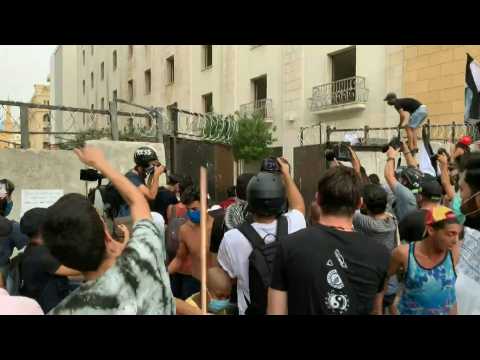 Lebanese protesters force open gate leading to parliament amid Macron visit
