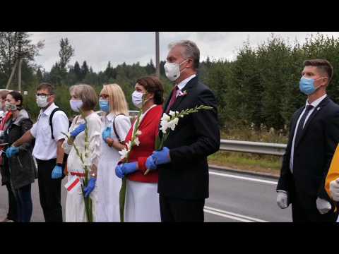 Thousands form human chain from Vilnius to Belarus in show of solidarity
