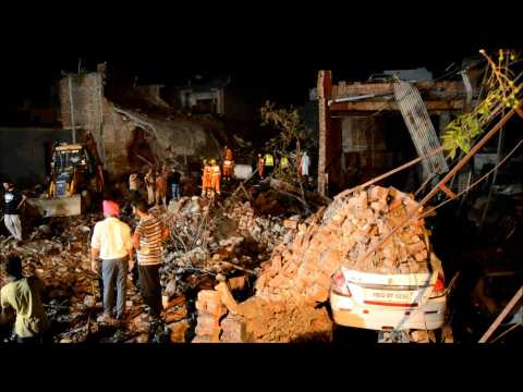 People gather at site of deadly India firework factory blast