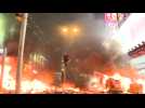Hong Kong protesters set fire to road barriers in city's shopping district