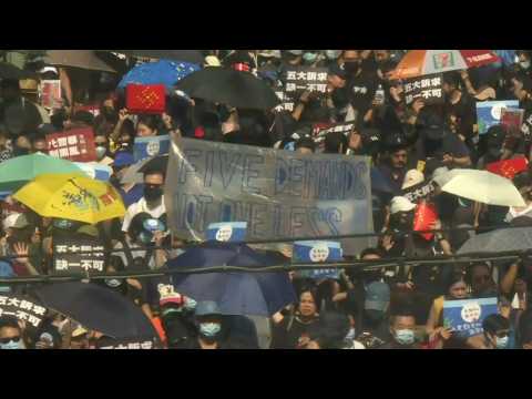 Large rally in Hong Kong as protesters again defy police ban