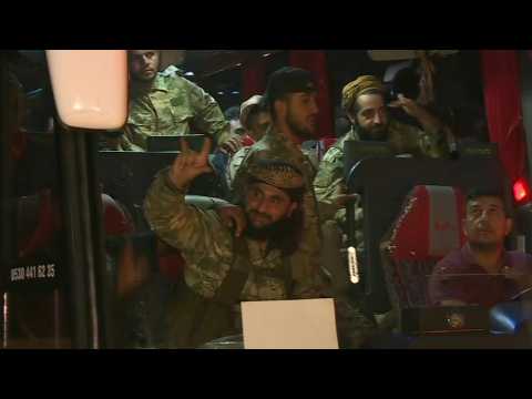 Convoy of Turkish-backed Syrian fighters heads to Syria