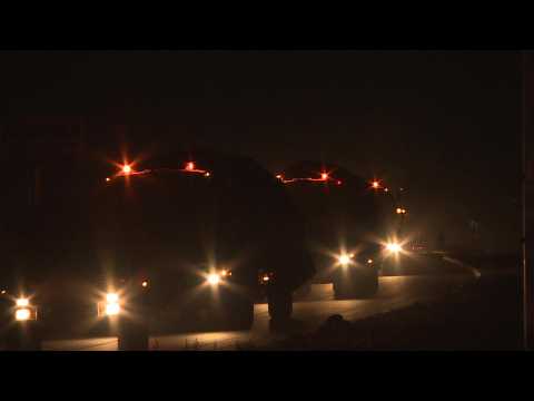 Convoy of Turkish-backed Syrian fighters arrives near the border with Syria