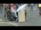 Protesters and police clash again in Ecuador capital