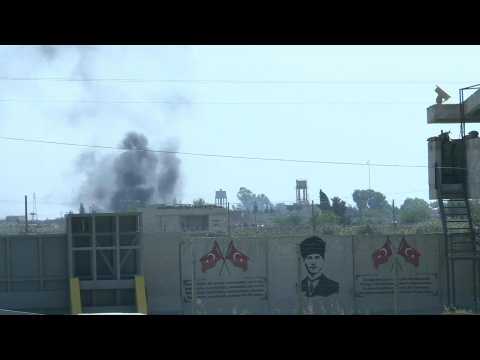 Smoke billows above Syrian border in Kurdish-controlled areas